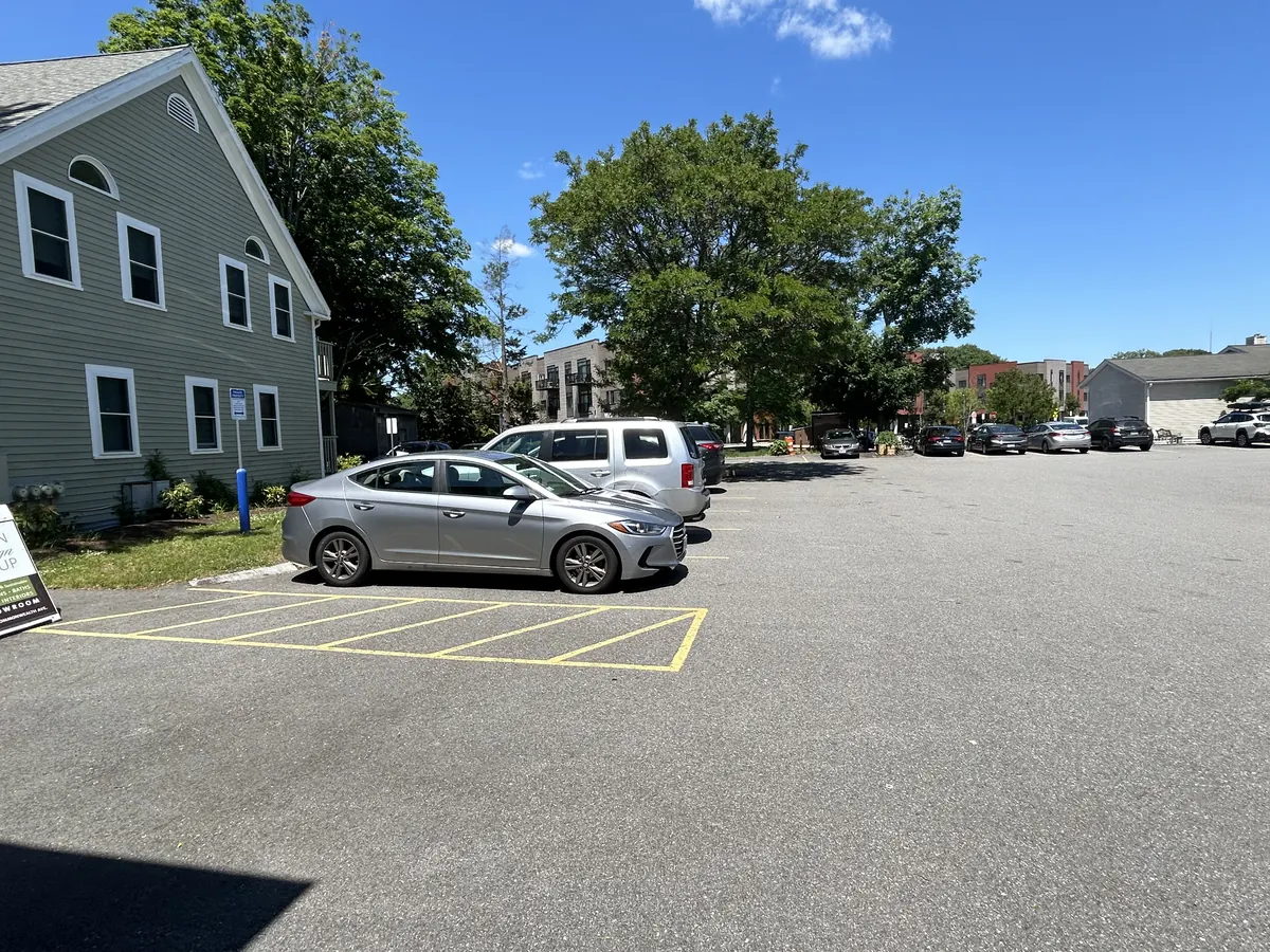 The parking lot behind the building on a sunny day